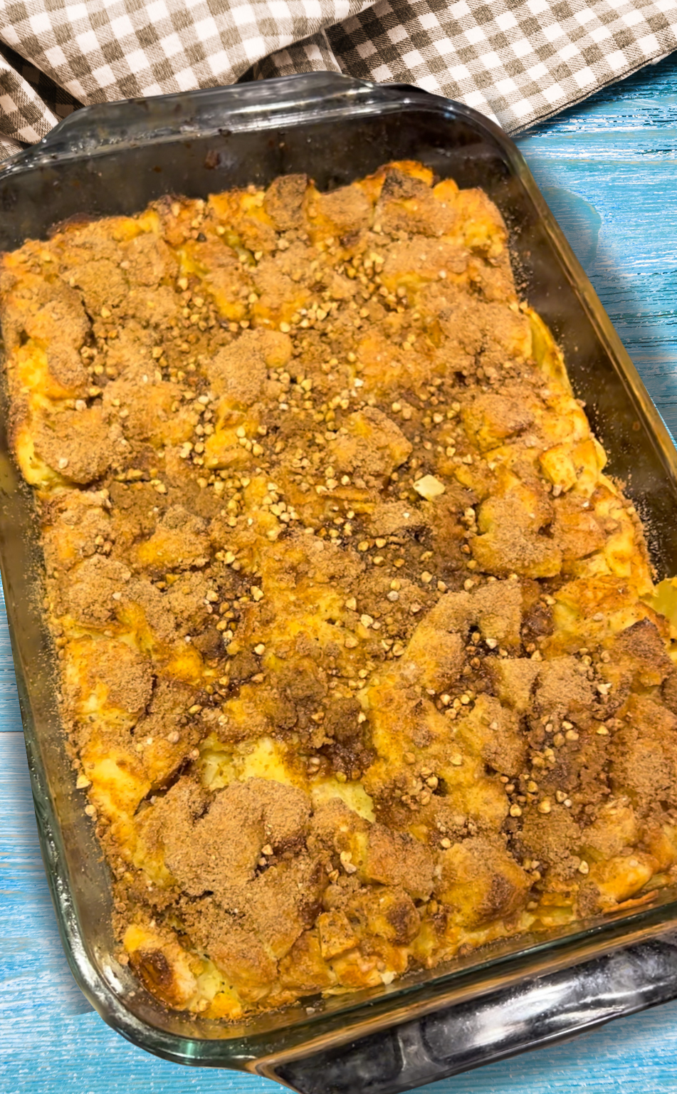 Overhead view of French toast bake in 9x13 dish topped with cinnamon streusel and crunchy Lil Bucks pieces