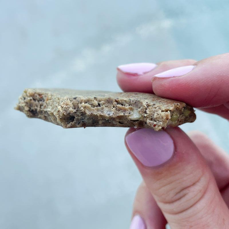 close up of bar with bite in it of Elavi and Lil Bucks protein bar with sprouted buckwheat groats