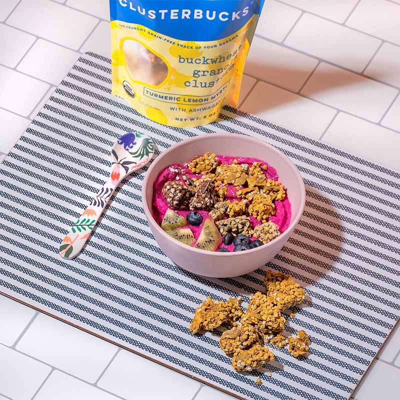 Golden Chai with Lemon Clusterbucks grain free granola, superfood snack on top of a smoothie bowl