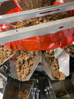 clusterbucks being made at the facility in a machine to pack the clusters